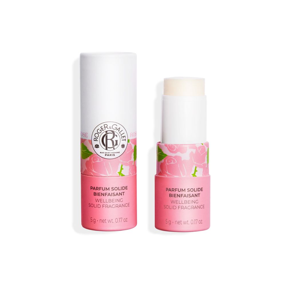 Deux sticks parfumés. Un stick est ouvert. Emballage rose et blanc avec motif floral. Inscription : Roger & Gallet, Parfum Solide.