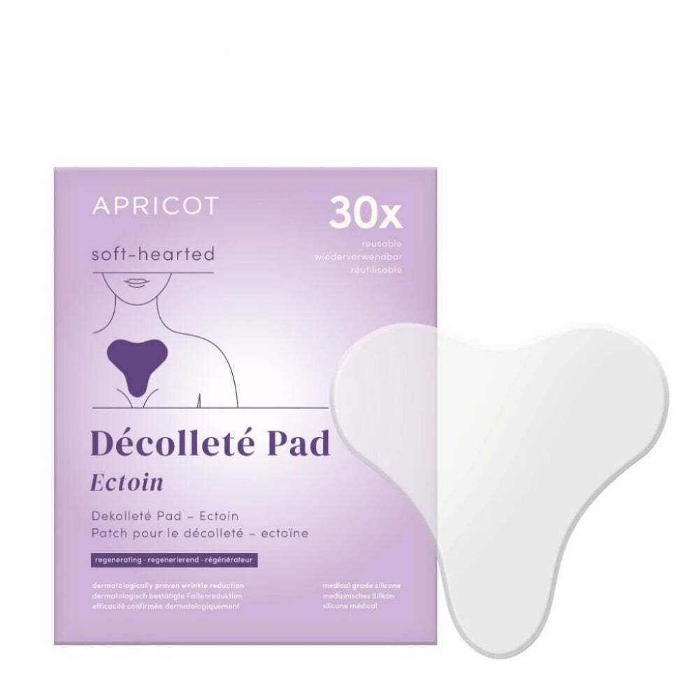 Verpackung mit APRICOT Décolleté Pad. Aufdruck: 30x, Ectoin. Weisses Dekolleté Pad daneben.