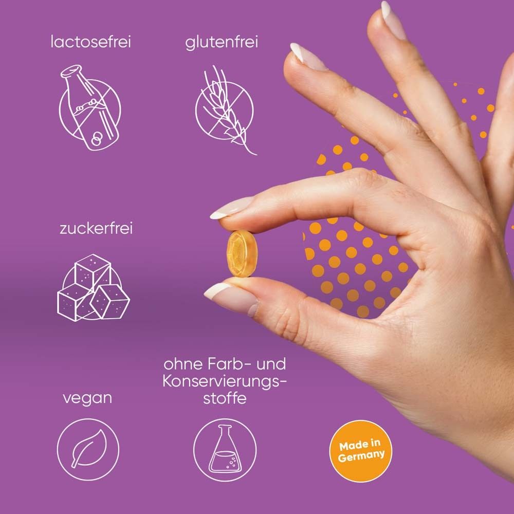 Hand hält Pastille. Icons: laktosefrei, glutenfrei, zuckerfrei, vegan, ohne Farb- und Konservierungsstoffe.