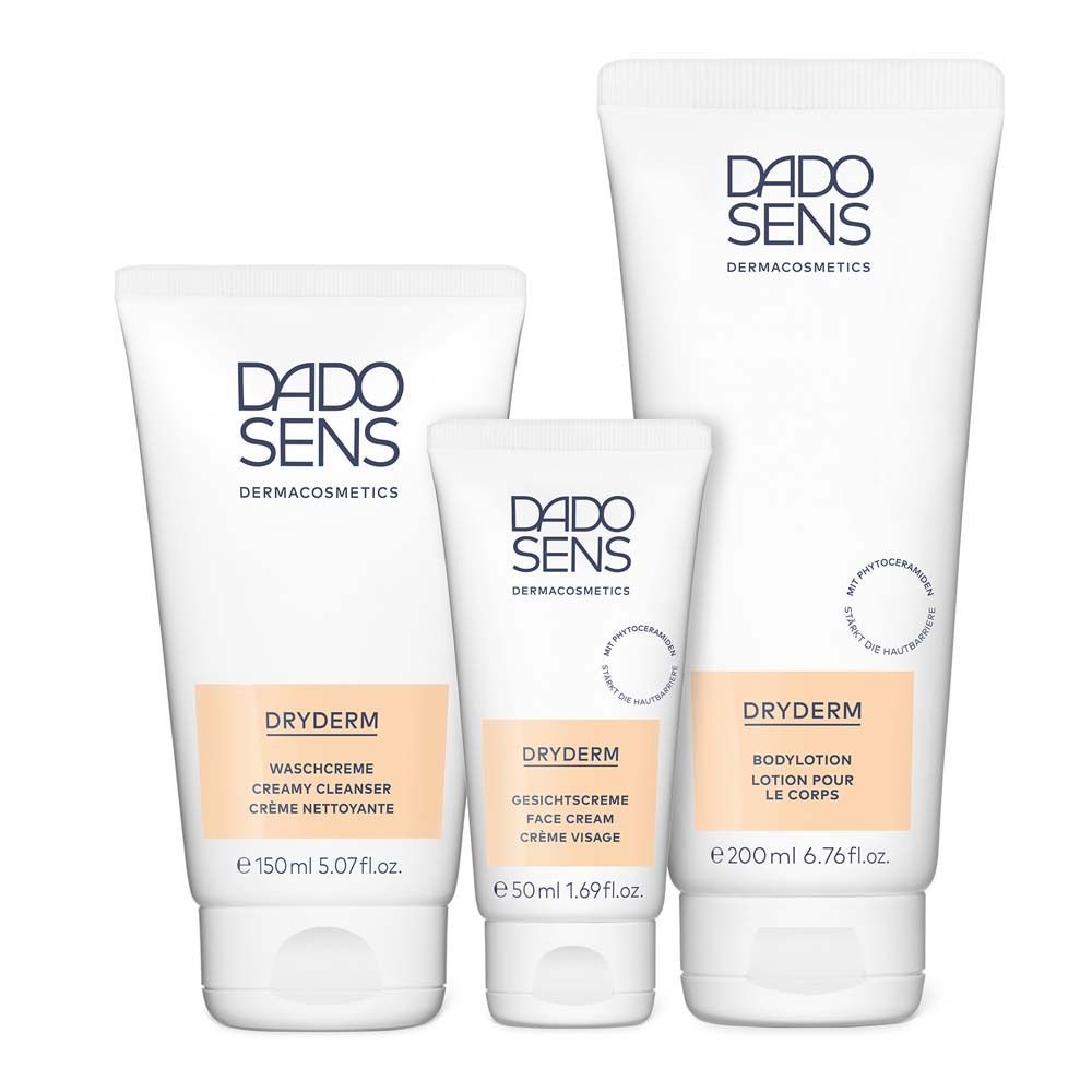 Trois produits DADOSENS DRYDERM côte à côte. Crème lavante, crème visage, lotion corporelle. Tubes blancs avec texte beige.
