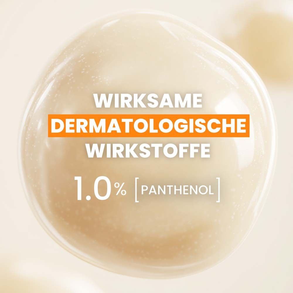 Nahaufnahme einer Flüssigkeit. Text: Wirksame dermatologische Wirkstoffe, 1.0% Panthenol.