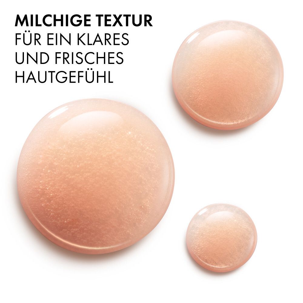Drei durchscheinende, perlmuttartige Tropfen mit Glitzerpartikeln.
