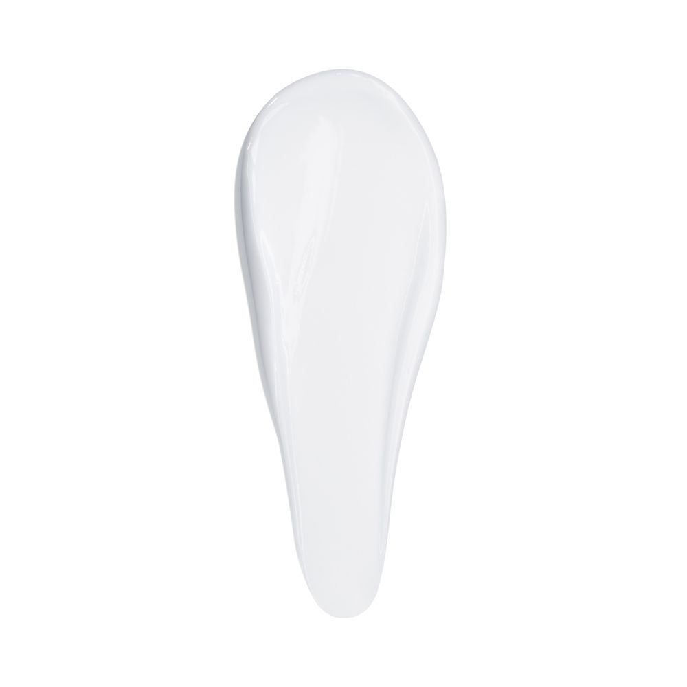 Weißer Creme-Tropfen auf weißem Hintergrund.