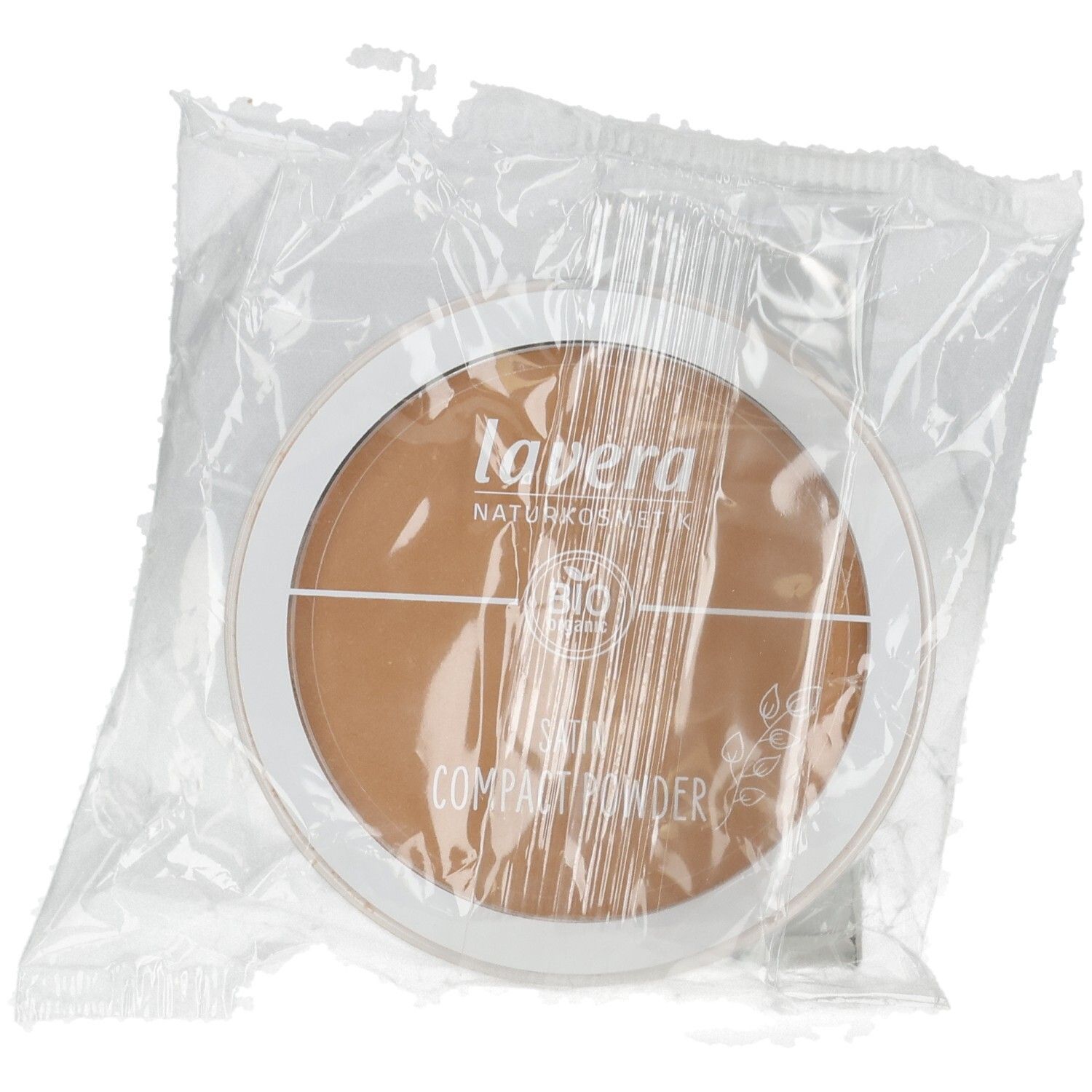 Tavera Naturkosmetik Kompaktpuder in braunem Farbton, verpackt in Folie. Mit Bio-Siegel.