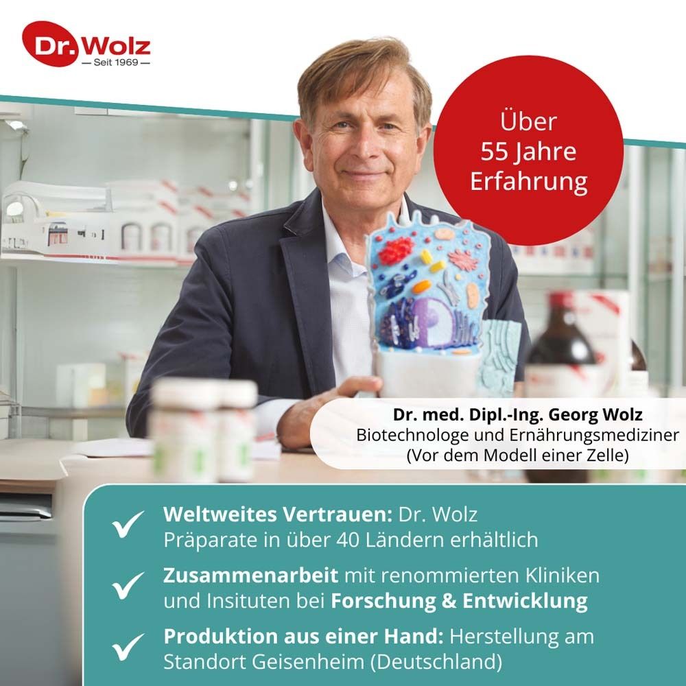 Mann mit Modell einer Zelle. Text: Über 55 Jahre Erfahrung. Dr. med. Dipl.-Ing. Georg Wolz. Weltweites Vertrauen. Produktion aus einer Hand.