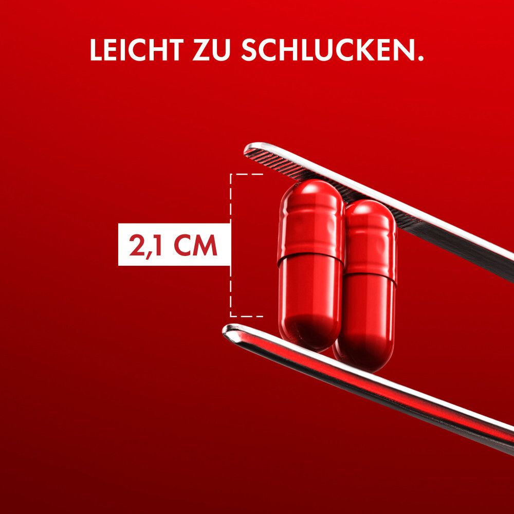 Zwei rote Kapseln in einer Pinzette. Text: Leicht zu schlucken. 2,1 cm.