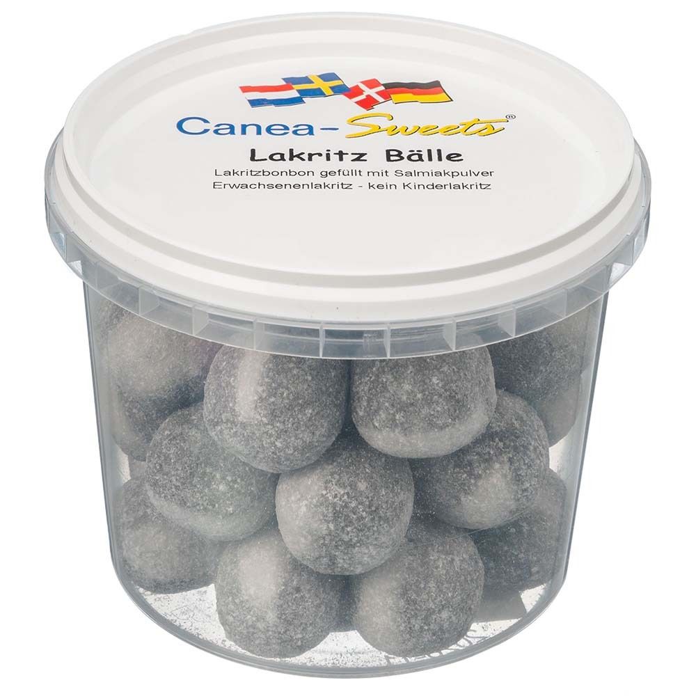 Seau transparent rempli de boules grises. Le couvercle porte l'inscription "Canea-Sweets" et "Lakritz Bälle".