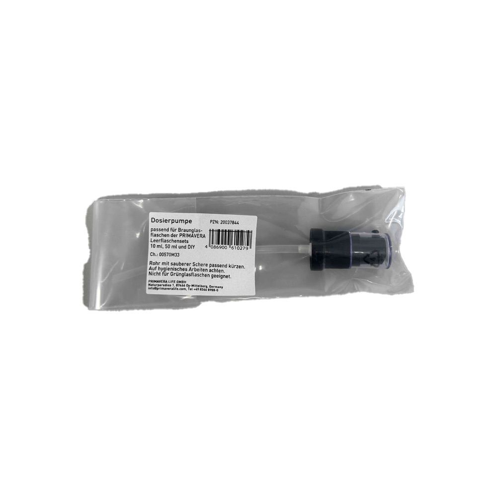 Dosierpumpe mit Schlauch in Verpackung. Schwarz und transparent.