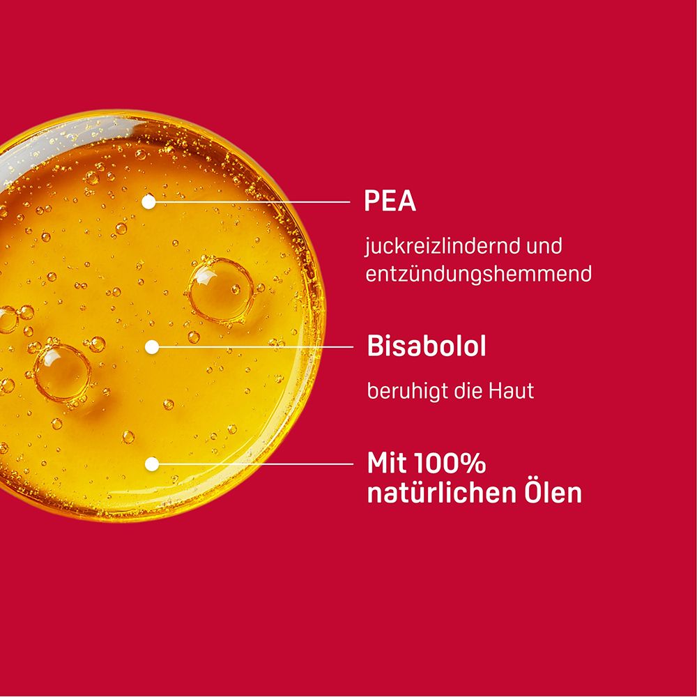 Ingrédients : PEA, Bisabolol, 100% huiles naturelles. Gros plan liquide jaune avec bulles.