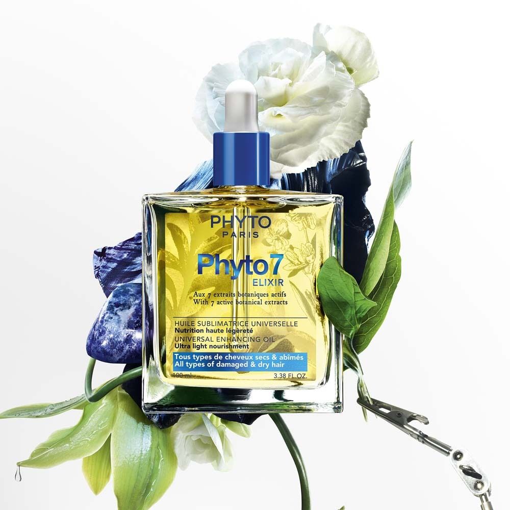 Image du produit: Phyto 7 Elixir. Flacon entouré de fleurs et de feuilles. Bouchon bleu et pipette.