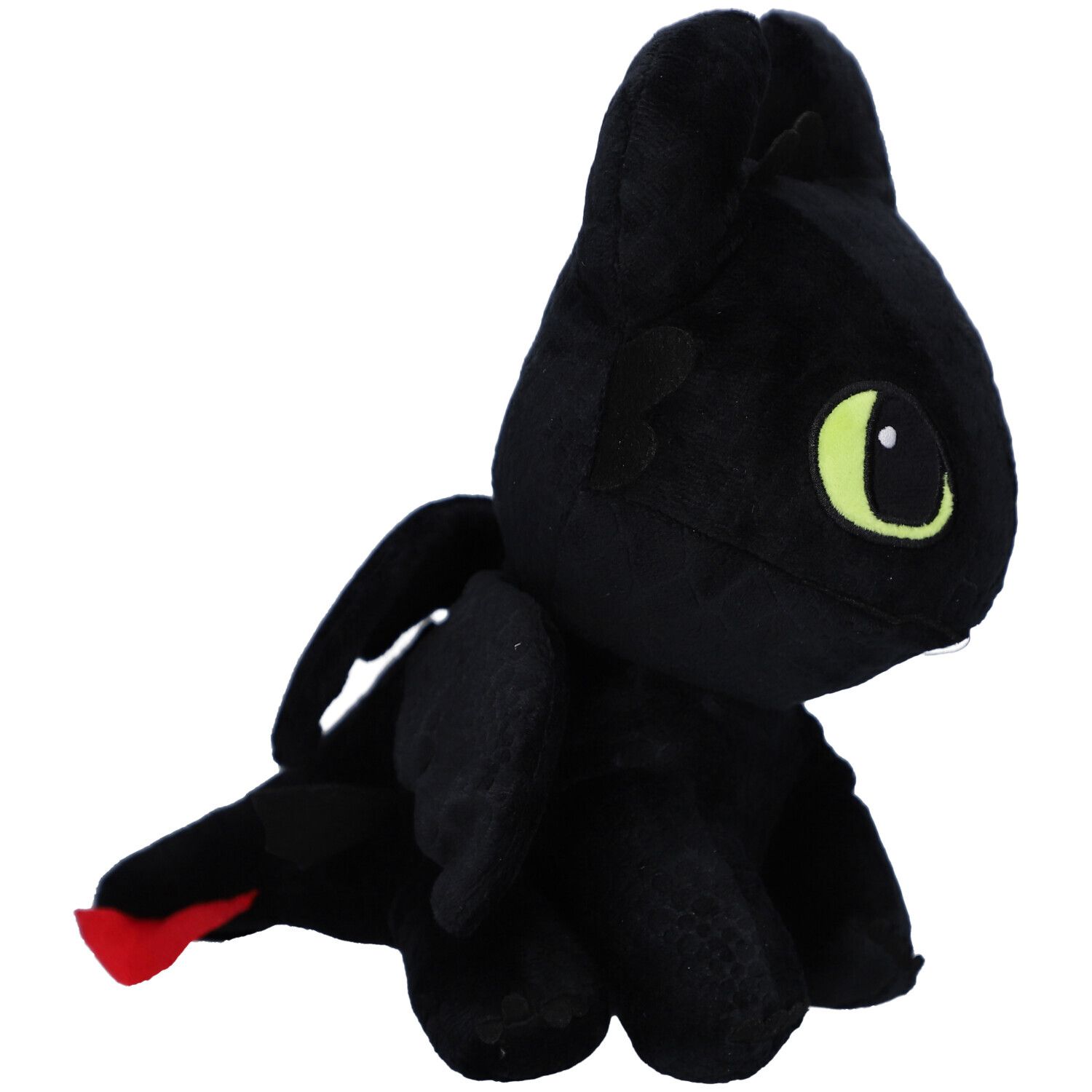 Peluche noire en forme de dragon, yeux verts, oreilles, ailes. Accent rouge sur la queue. Vue latérale.