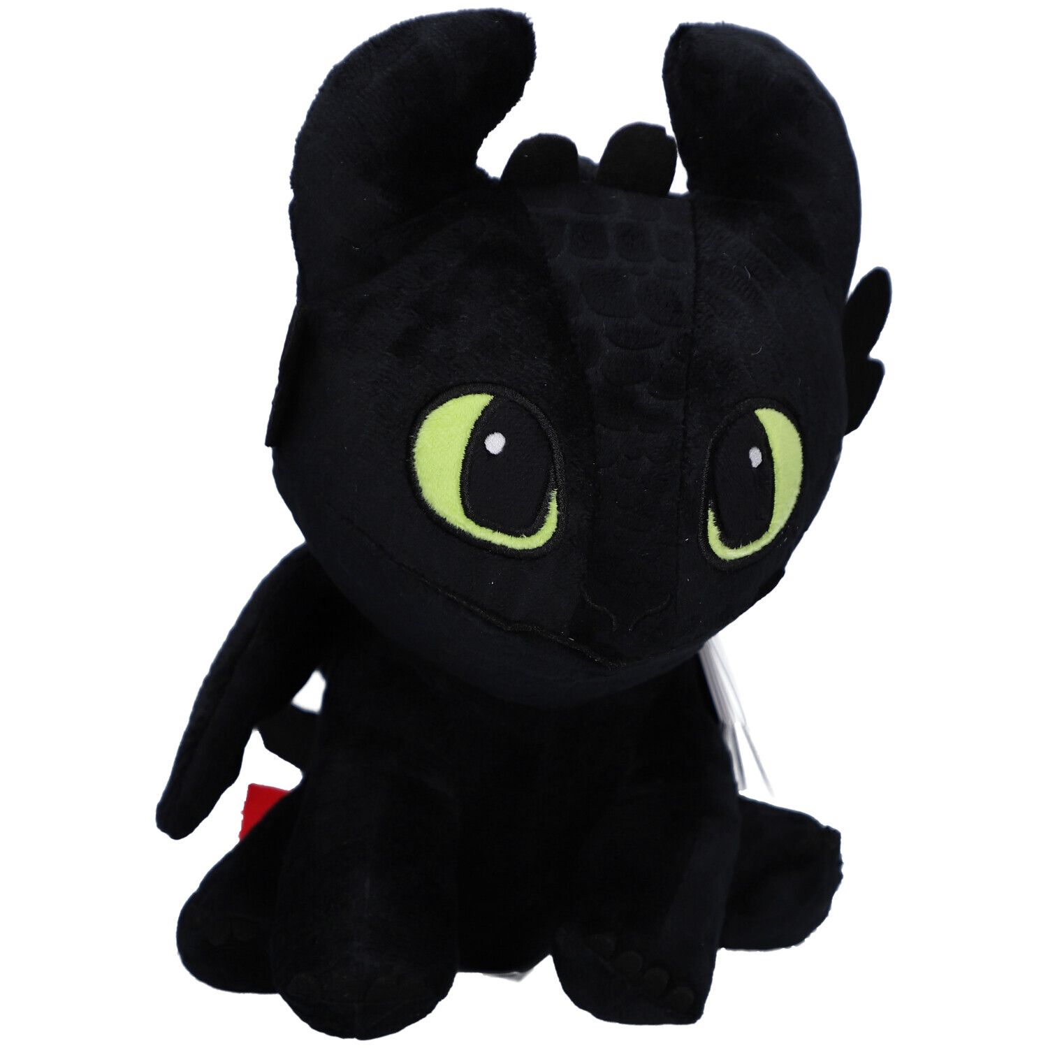 Peluche noire en forme de dragon, yeux verts, oreilles, ailes. Sur fond clair.