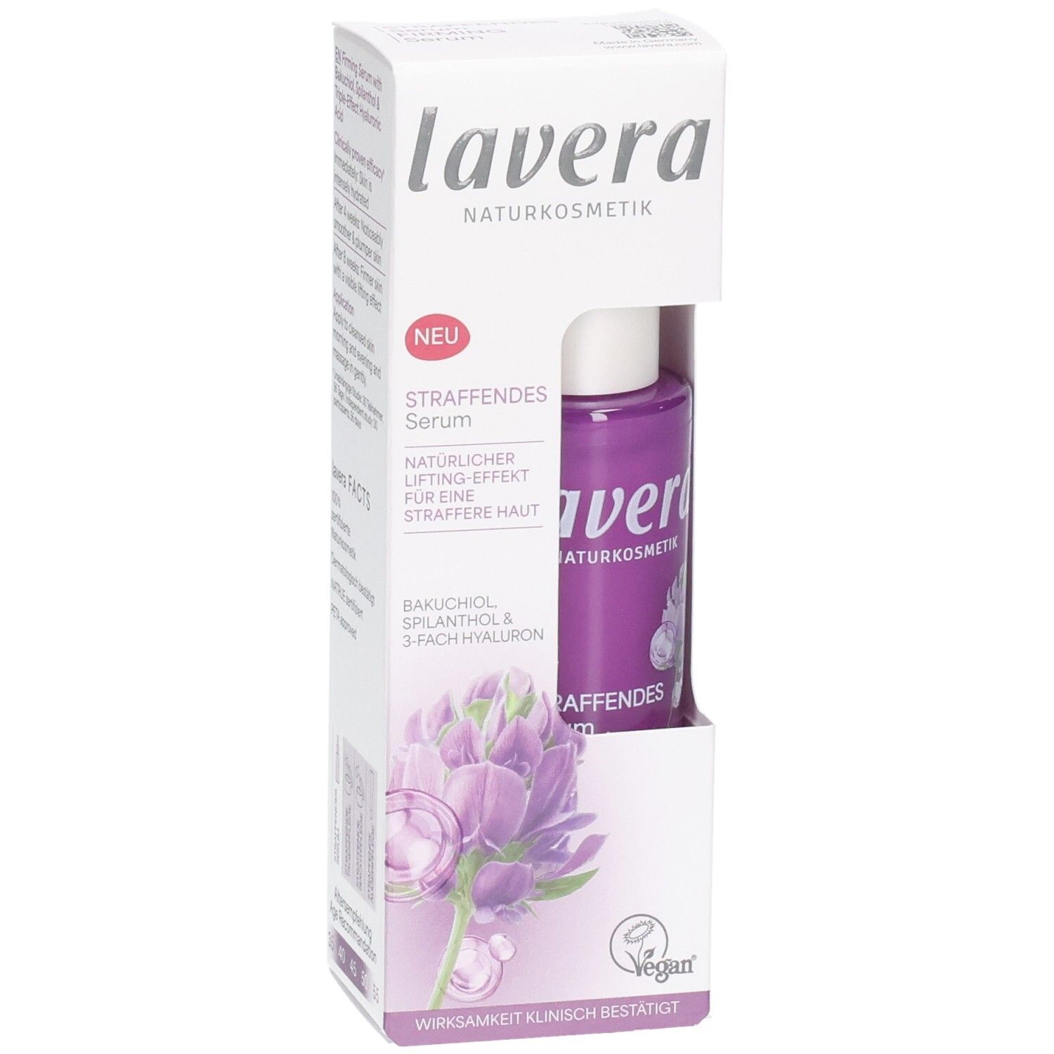 Lavera Straffendes Serum in violetter Flasche, verpackt in weißer Kartonage mit Blütenmotiv und Siegeln.