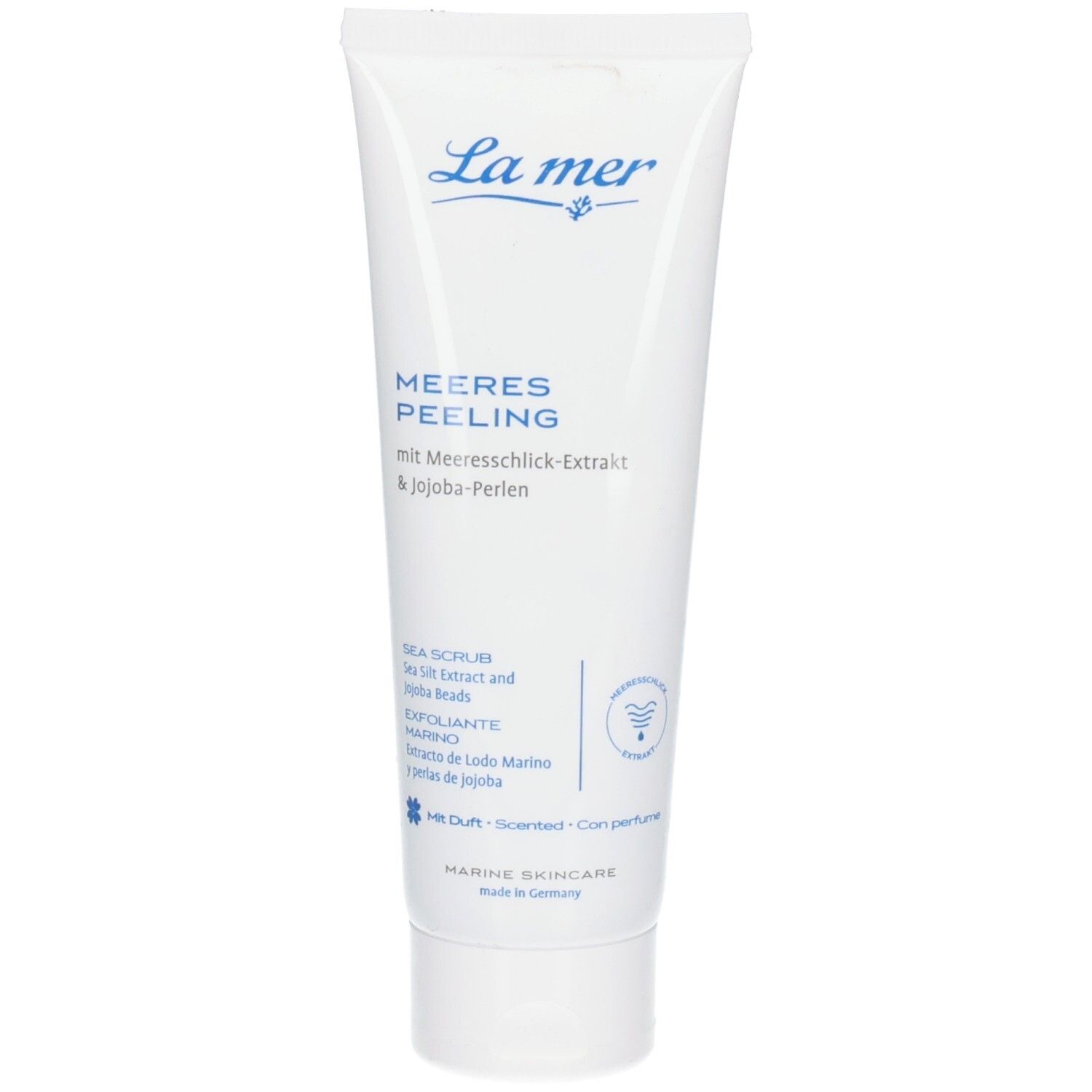 Weiße Tube mit La mer Meeres Peeling, Meereschlick-Extrakt und Jojoba-Perlen.