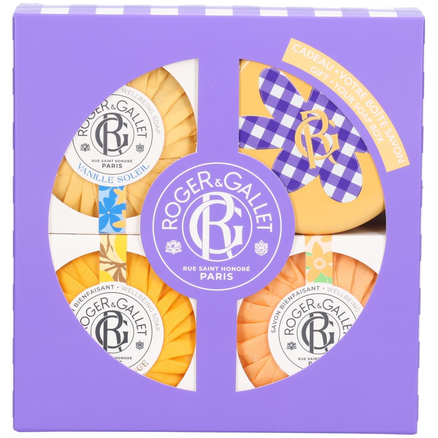 Roger & Gallet Seifen-Set in violetter Geschenkbox mit vier runden Seifen in Gelb- und Orangetönen.