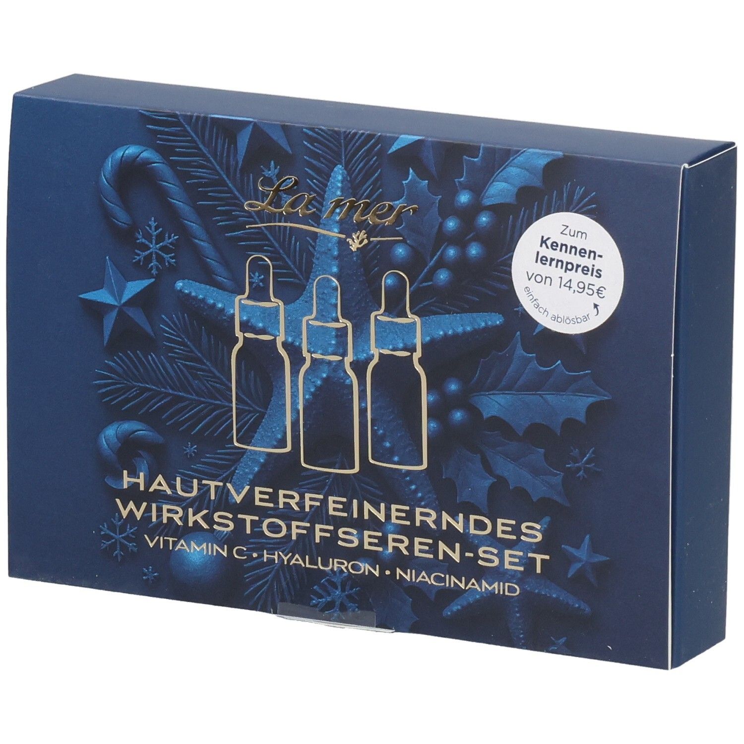 Verpackung mit drei Seren: Vitamin C, Hyaluron und Niacinamid, mit weihnachtlichem Design.