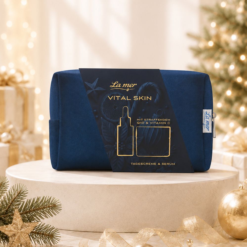 La Mer Kosmetiktasche in Dunkelblau mit goldfarbenem Aufdruck. Enthält eine goldene Pipette und einen Tiegel.