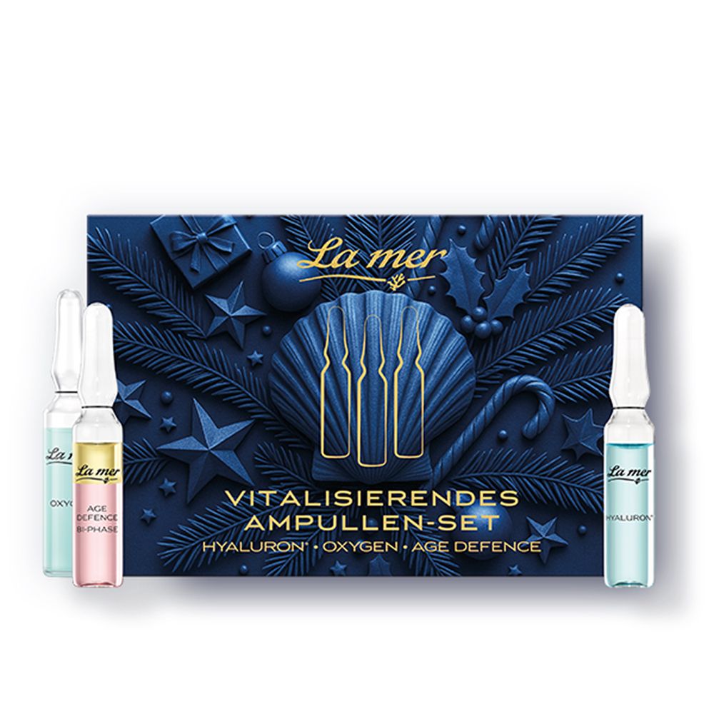 La Mer Ampullen-Set mit drei Ampullen in Blau, Rosa und Hellblau. Dunkelblaue Verpackung mit Sternen und Tannenzweigen.