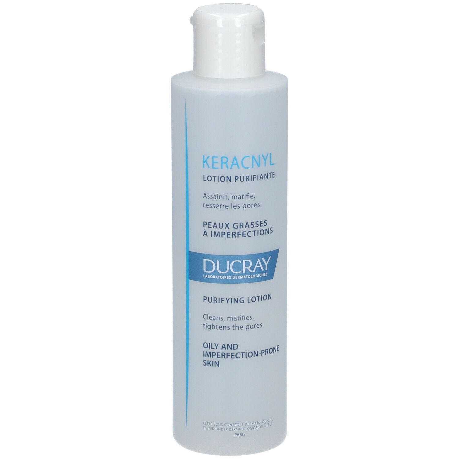 Lotion nettoyante Ducray KERACNYL. Bouteille blanche avec étiquette bleue. Nom du produit et caractéristiques imprimés.