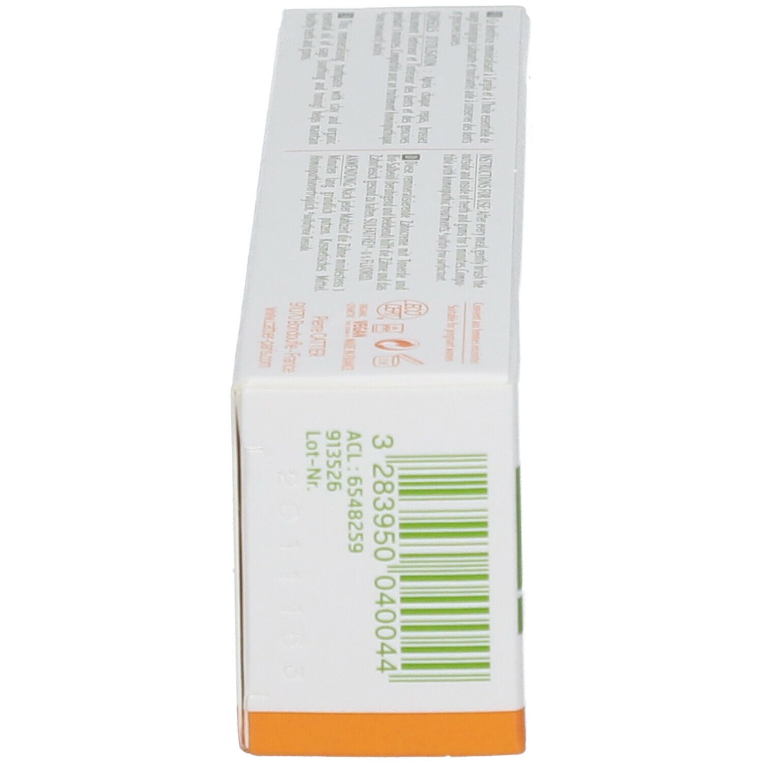 Schachtel, Seitenansicht. Text: Chargennummer, EAN-Code, 75ml. Grüne und orangefarbene Akzente.
