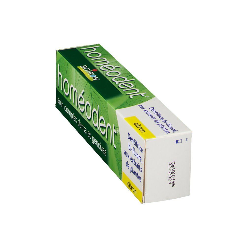 Emballage de dentifrice en biais. Vert et blanc. Inscription: homéodent. Impression: soin complet dents et gencives. Citron.