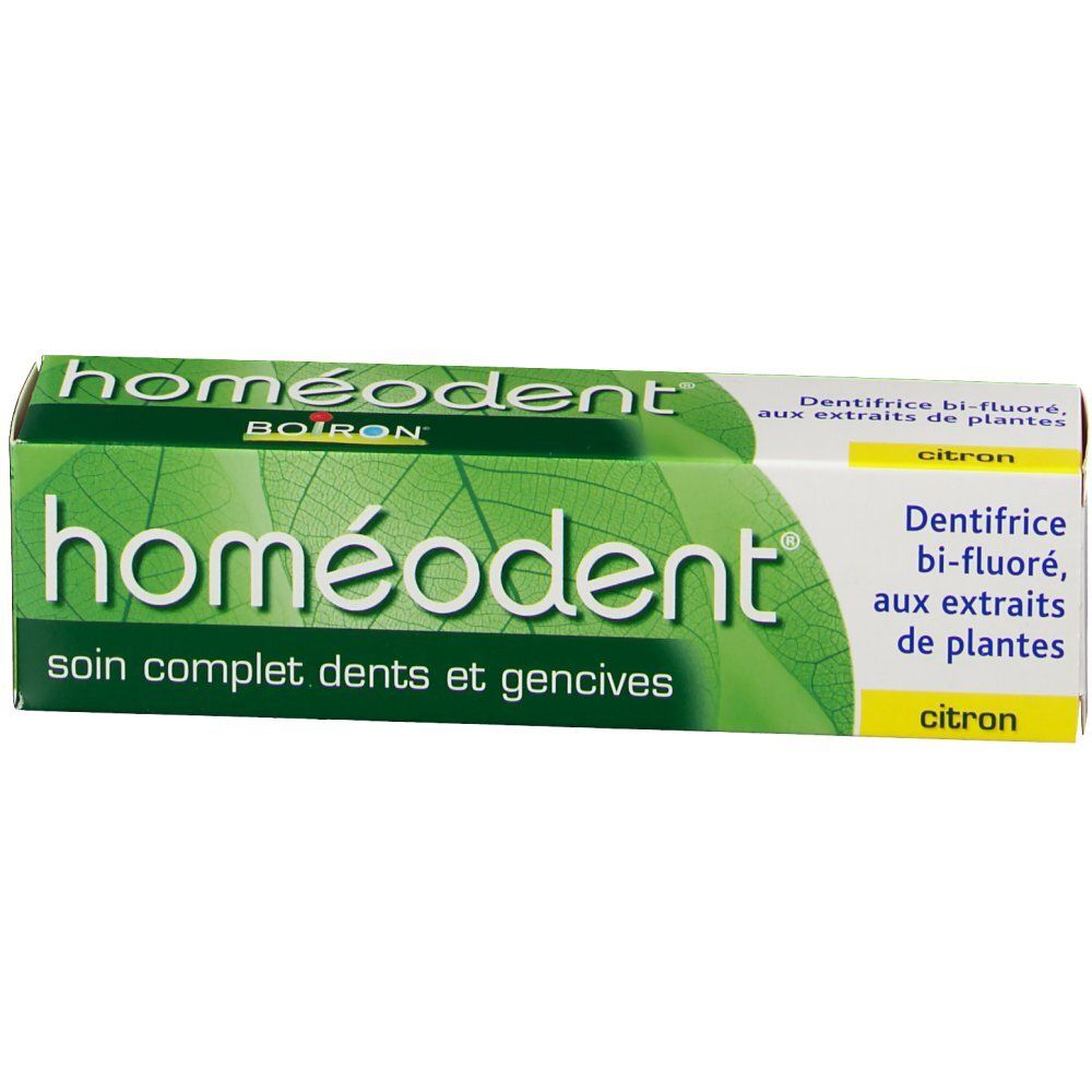 Emballage de dentifrice. Vert et blanc. Inscription: homéodent, soin complet dents et gencives. Goût citron.
