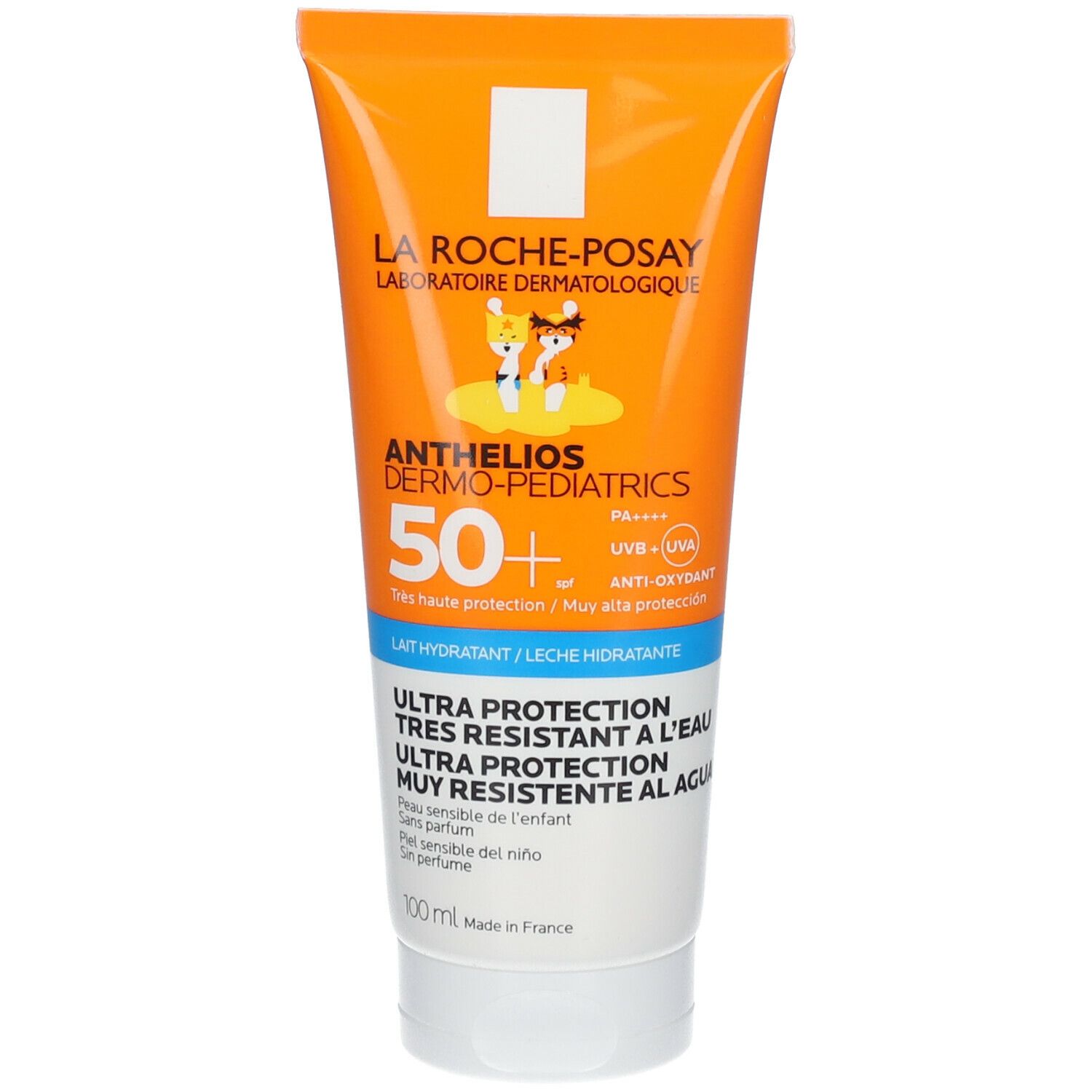 Tube de crème solaire orange et blanche. Inscription: ANTHELIOS DERMO-PEDIATRICS 50+. Ultra protection. Pour peau sensible des enfants. 100 ml.