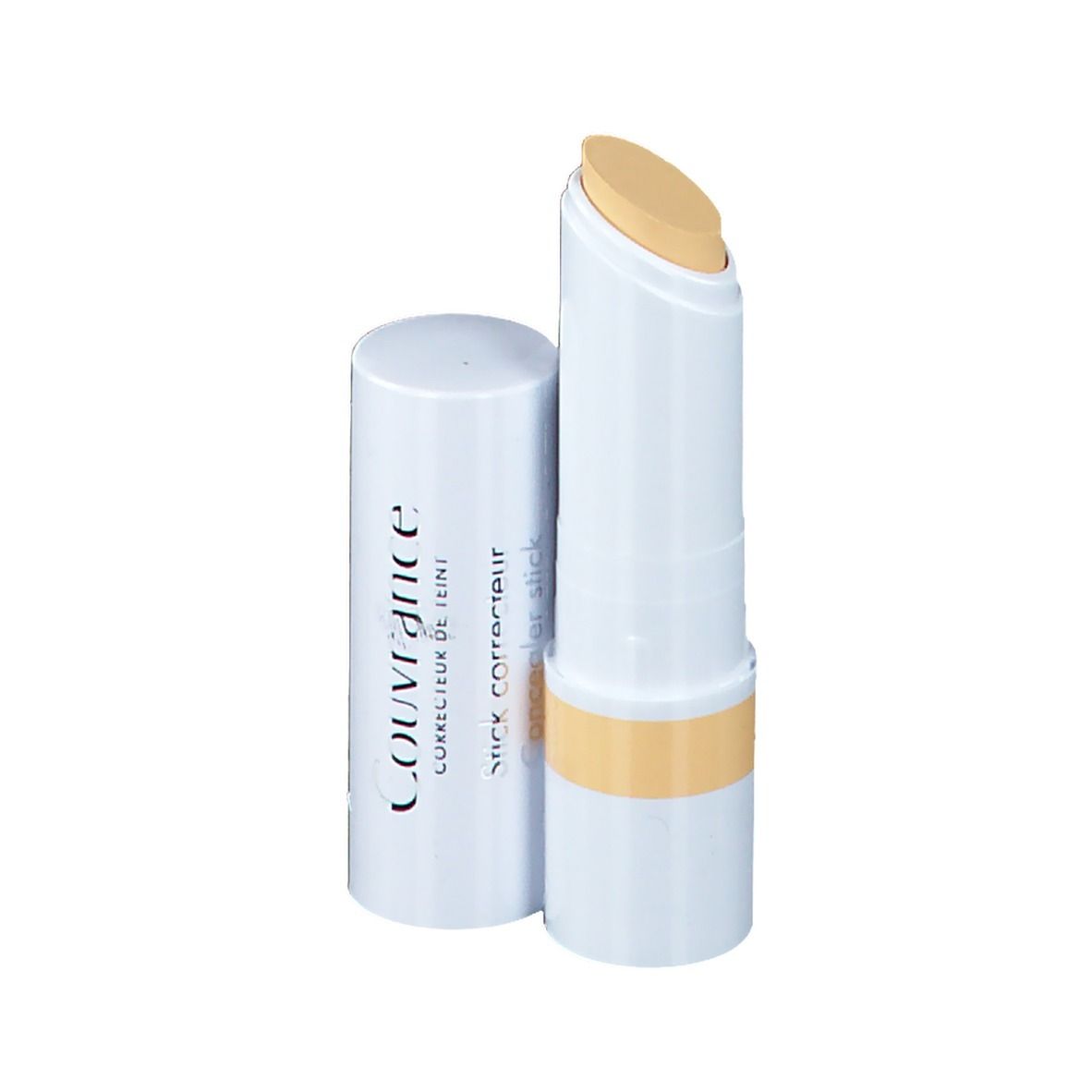 Gelber Concealer-Stick, weißer Stift mit gelbem Produkt. Deckel daneben.