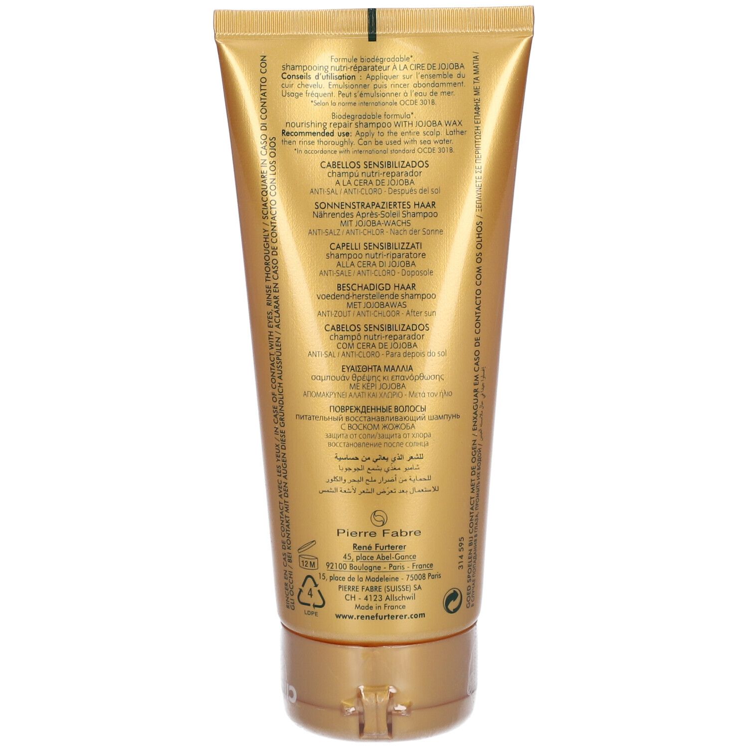 Rückseite einer goldfarbenen Tube Shampoo. Text in mehreren Sprachen. Herstellerinformationen und Recycling-Symbol.