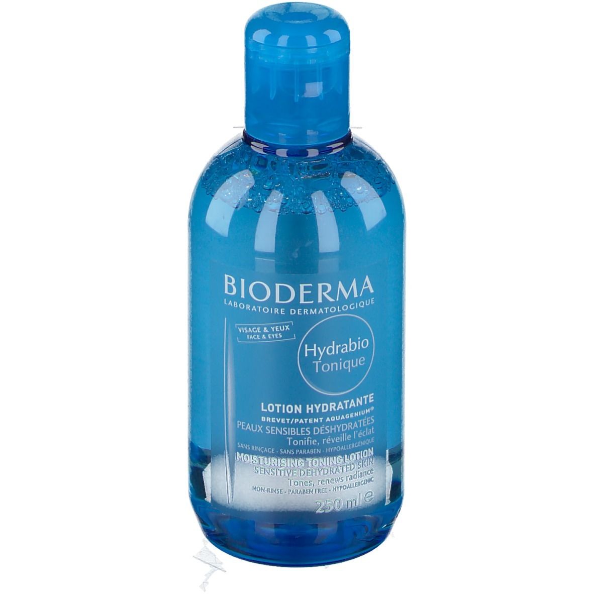 Blau-transparente Flasche mit blauem Deckel. Aufschrift: BIODERMA, Hydrabio Tonique, Lotion Hydratante. Für Gesicht & Augen.