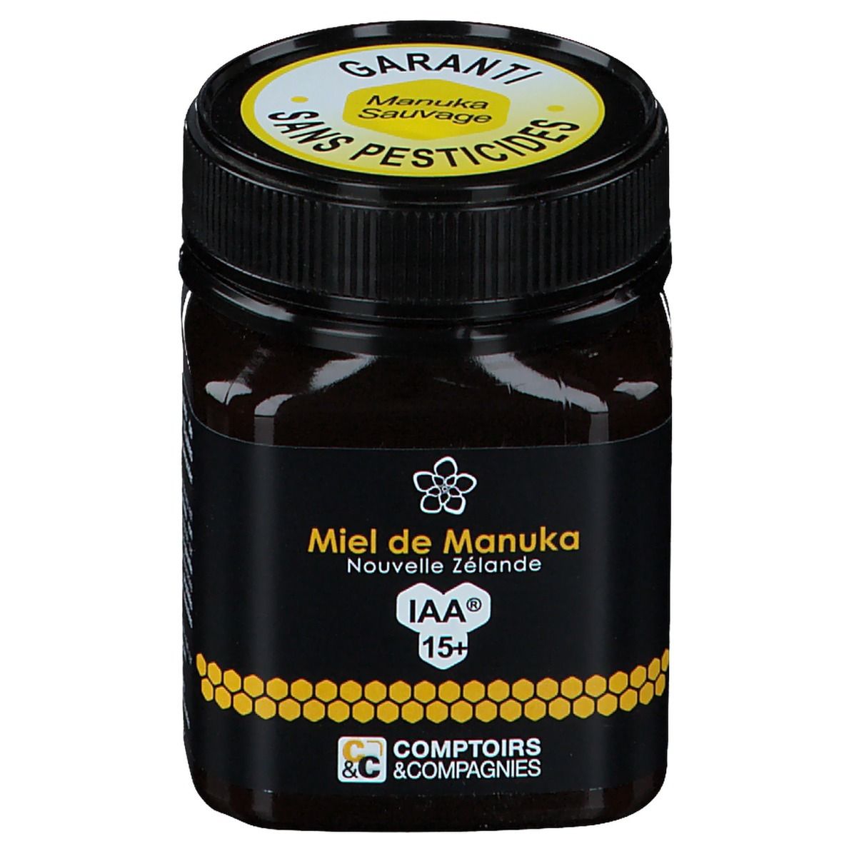 Pot de miel avec étiquette noire. Texte jaune : Miel de Manuka Nouvelle Zélande IAA 15+. Couvercle avec garantie et texte.