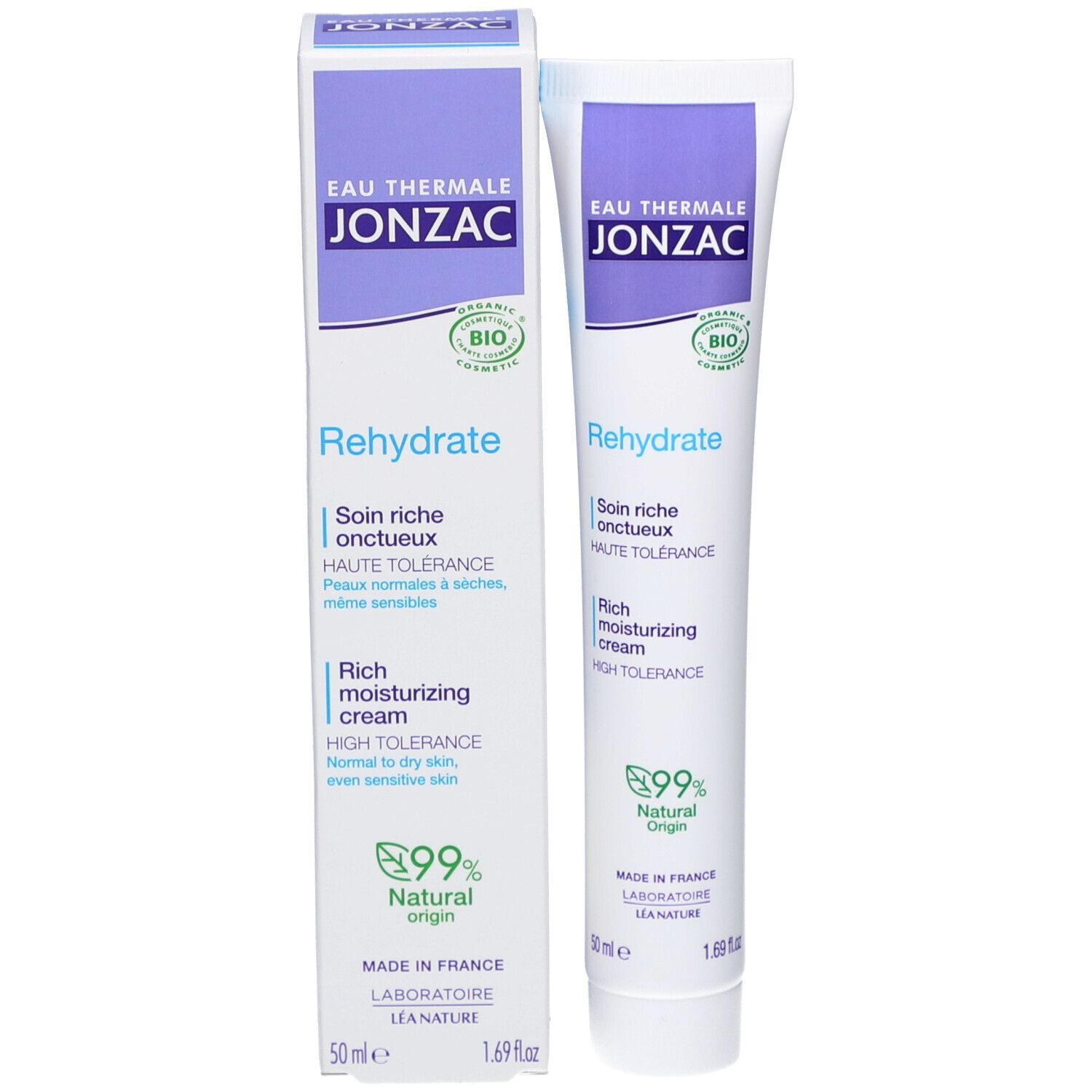Emballage du produit avec tube et boîte. Blanc, violet et vert. Texte : Rehydrate, Rich moisturizing cream, 99% Natural Origin.