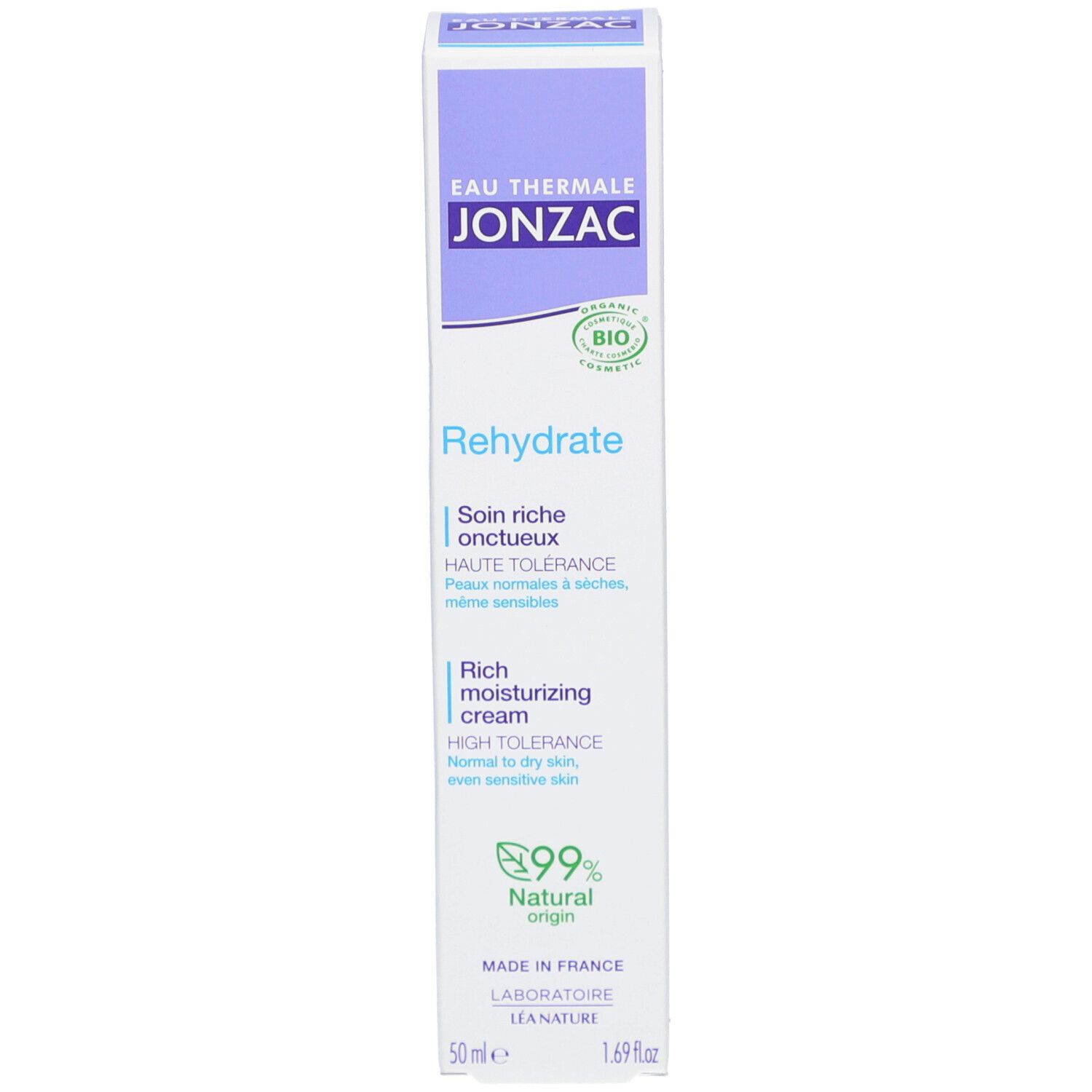 Emballage du produit avec boîte. Blanc, violet et vert. Texte : Rehydrate, Rich moisturizing cream, 99% Natural Origin.
