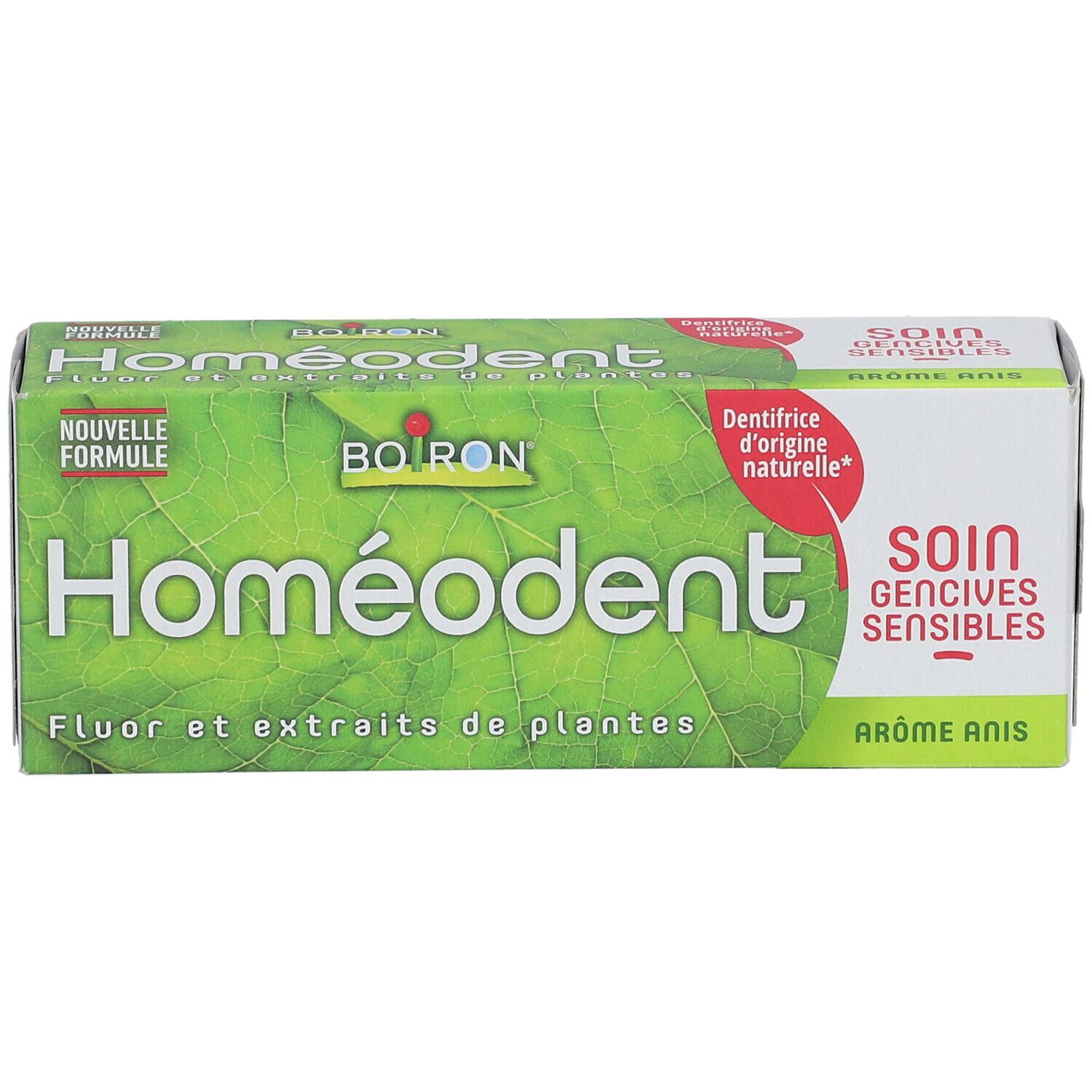 Zahncreme-Verpackung. Grün mit 'Homeodent' und 'Boiron' Logo. Text: 'Fluor et extraits de plantes'.