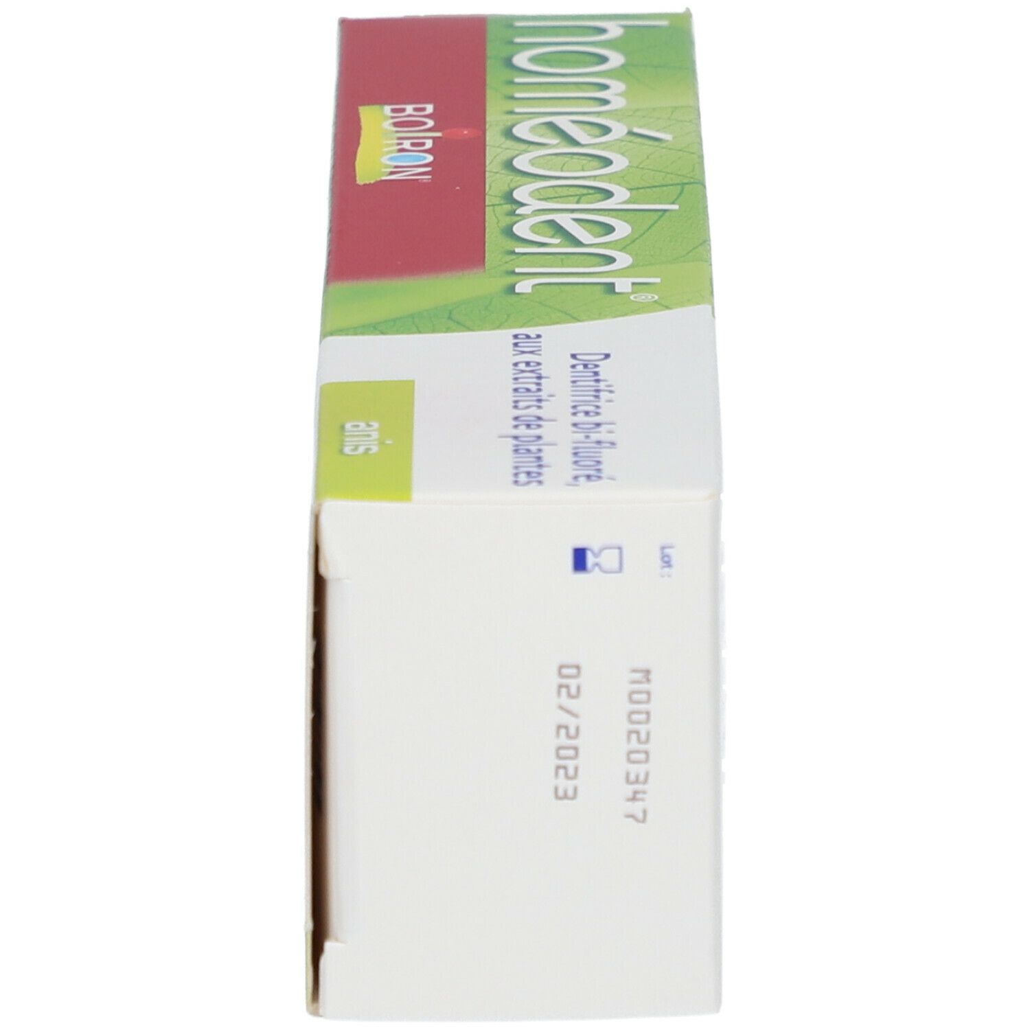 Zahncreme-Verpackung. Seite mit Text und Logo. Text: 'Homeodent' und 'Boiron'. Haltbarkeitsdatum.