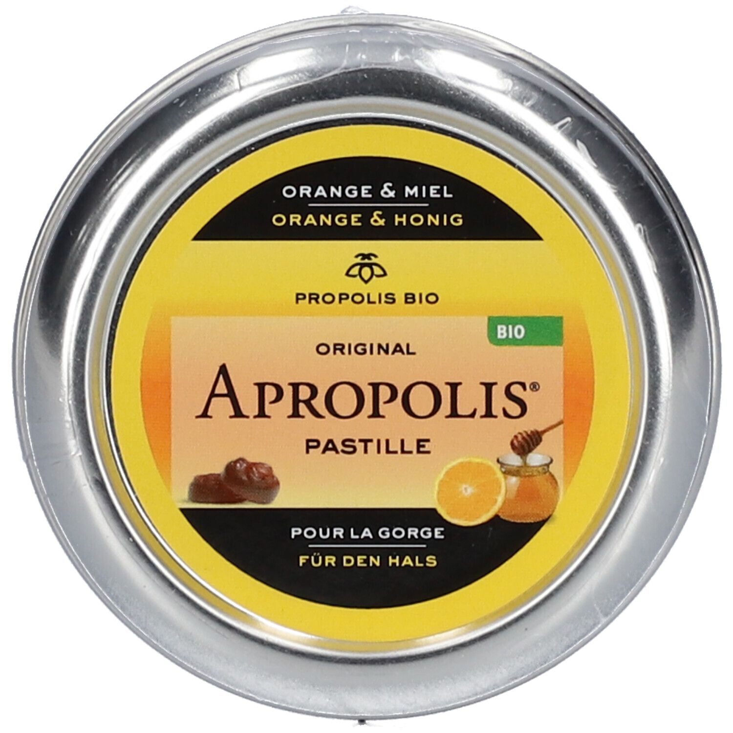 Runde Dose, leicht schräg. Gelbes Etikett mit Aufschrift: Apropolis Pastille. Dose in Folie verpackt.