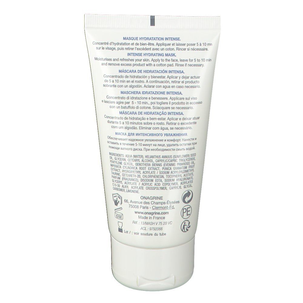 Rückseite der weißen Tube. Text in mehreren Sprachen: Anwendungshinweise, Inhaltsstoffe, Herstellerinformationen.