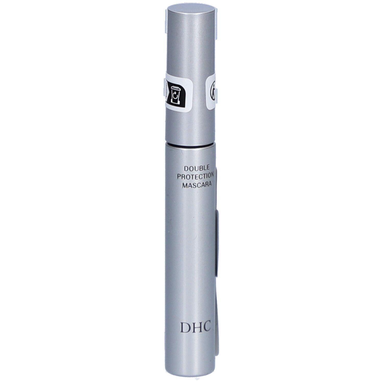 Tube de mascara argenté avec texte noir. Inscription : DOUBLE PROTECTION MASCARA et DHC. Deux sceaux sur le couvercle.