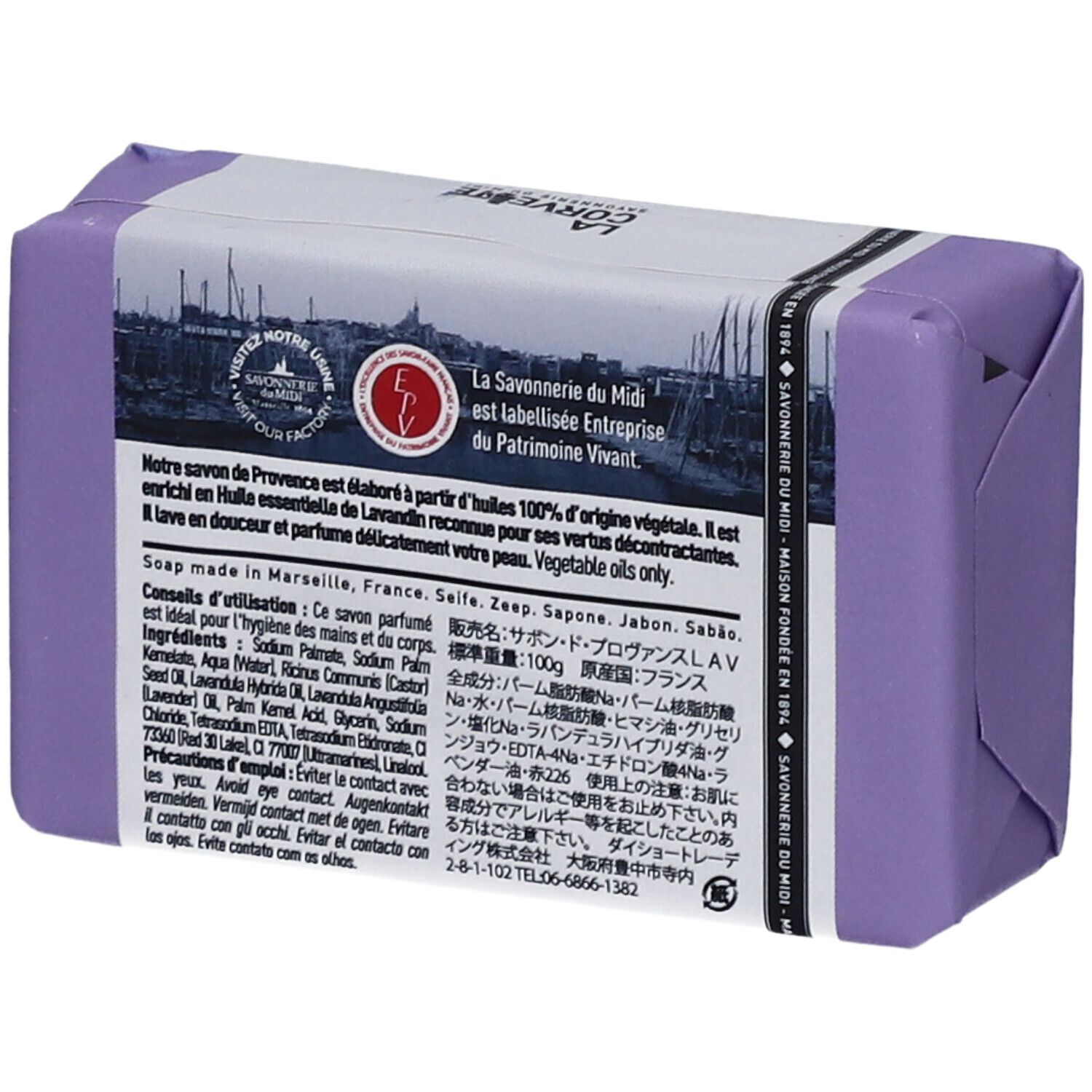 Dos d'un savon emballé en violet. Texte en plusieurs langues.
