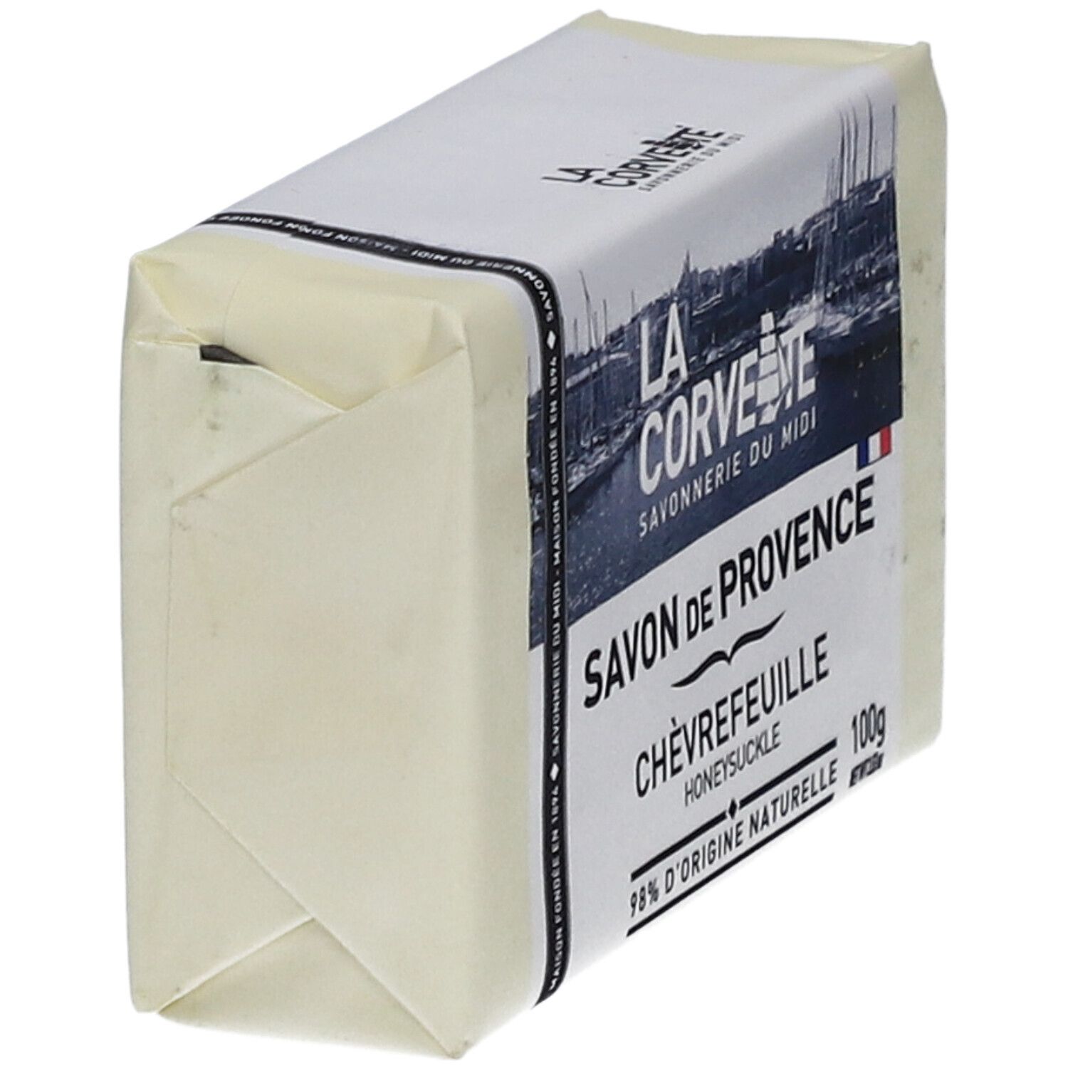 Savon emballé. Inscription: Savon de Provence Chèvrefeuille. Nom de marque et logo visibles.