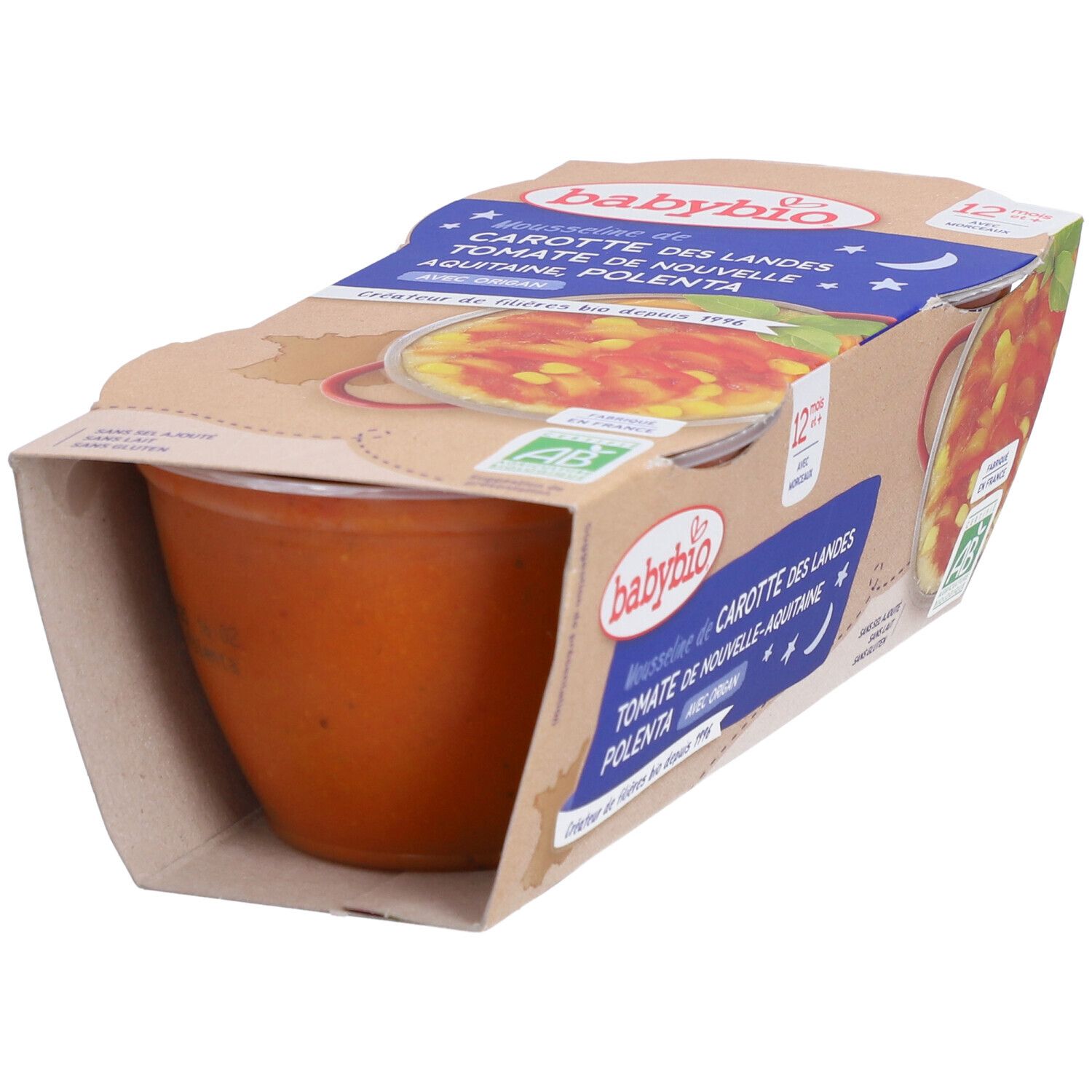 Verpackung mit Babybio-Mousse mit Karotten, Tomaten und Polenta. Sichtbar sind ein Becher und die Verpackung mit Produktinformationen.