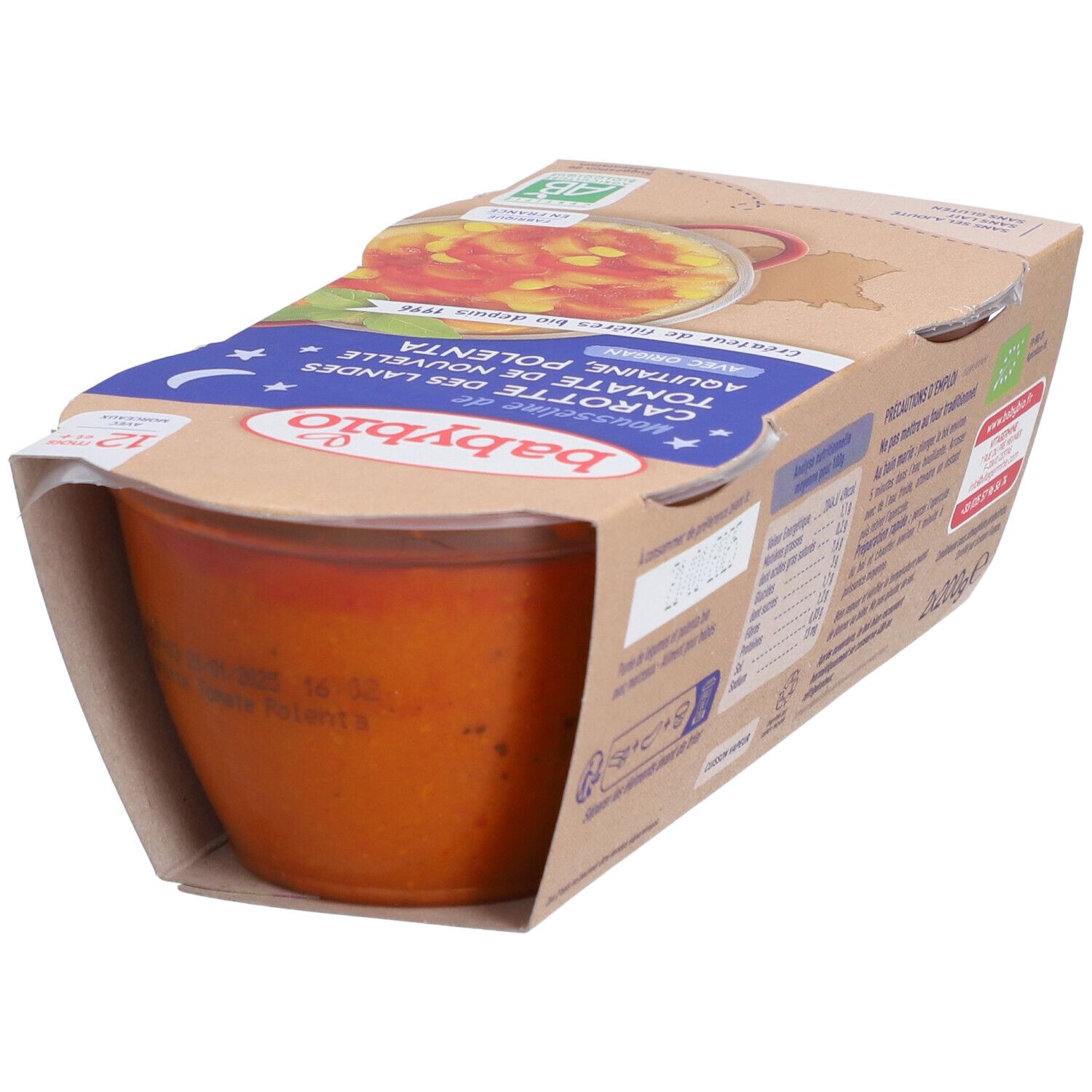 Verpackung mit Babybio-Mousse mit Karotten, Tomaten und Polenta. Der Becher ist teilweise sichtbar, mit Produktinformationen.