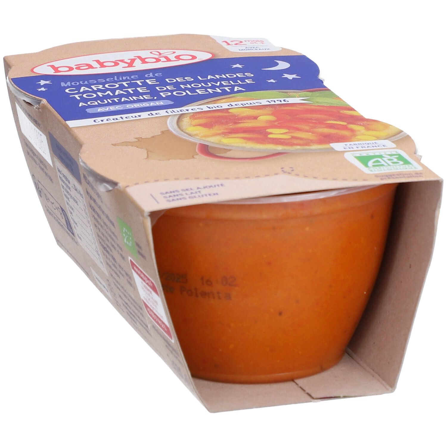 Verpackung mit Babybio-Mousse mit Karotten, Tomaten und Polenta. Der Becher ist teilweise sichtbar, mit Produktinformationen.