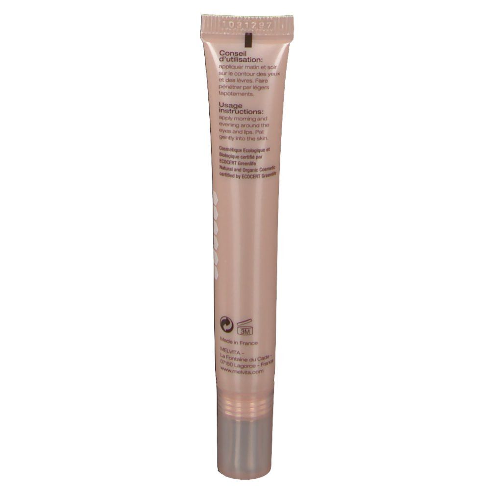 Dos du tube de crème. Texte : Conseil d'utilisation, Usage Instructions. Tube beige avec bouchon argenté. Logo et informations.