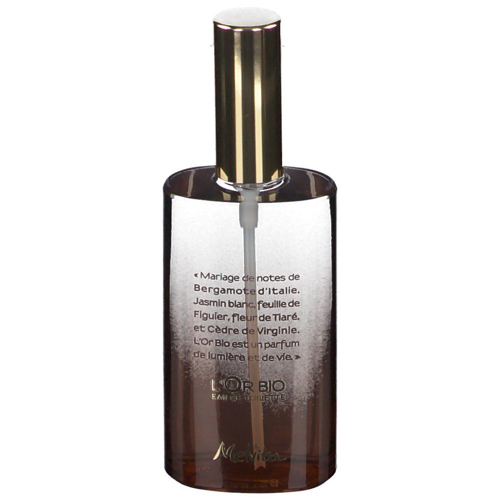 Flacon de parfum avec bouchon doré. Inscription: L'Or Bio Eau de Toilette. Texte avec ingrédients.