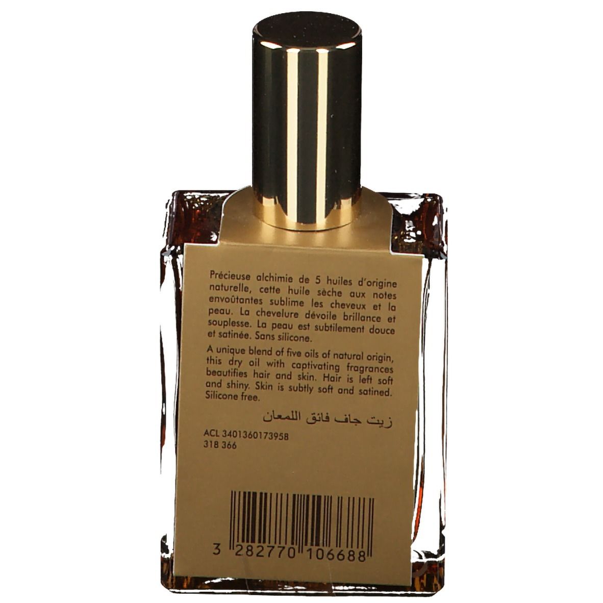 Dos du flacon. Texte: Précieuse alchimie de 5 huiles d'origine naturelle. Code, code-barres et autres informations.