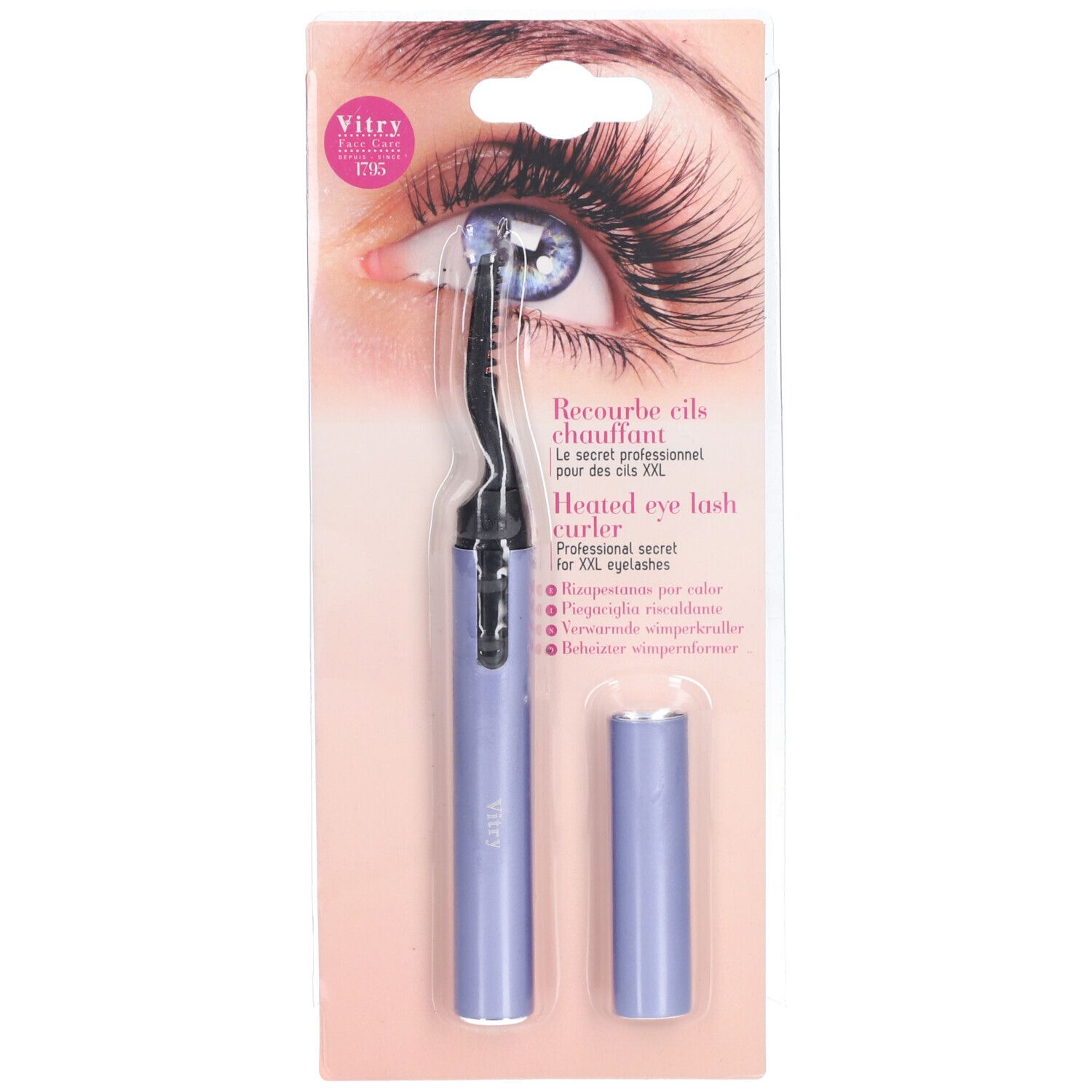 Beheizter Wimpernformer. Lila Gehäuse, schwarzer Formteil. In Verpackung mit Augen-Illustration. Marke Vitry.