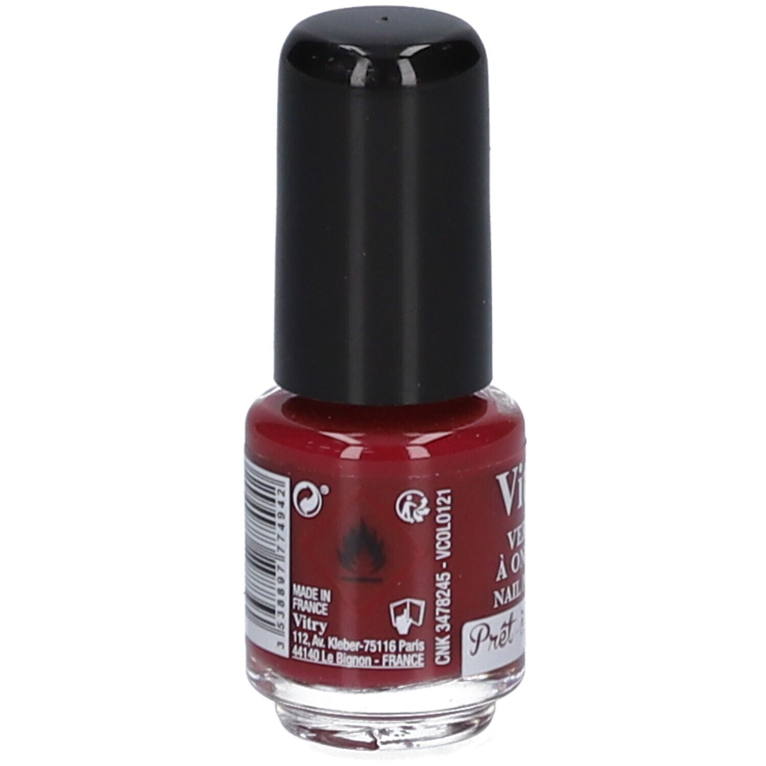 Rückseite einer Nagellackflasche. Schwarzer Deckel. Aufschrift: Vitry, Adresse, Barcode, Warnhinweise. Rote Flüssigkeit sichtbar.