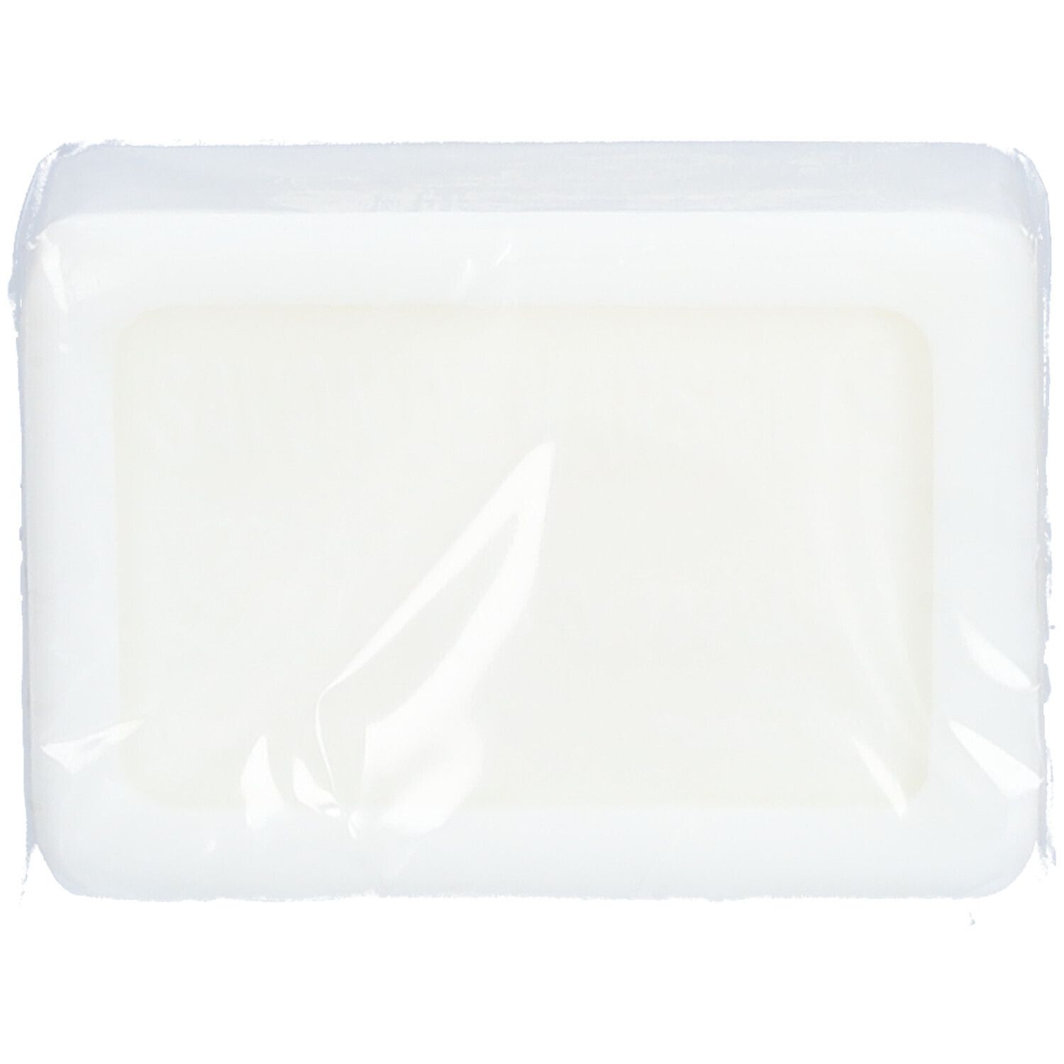 Savon rectangulaire emballé dans un film transparent.