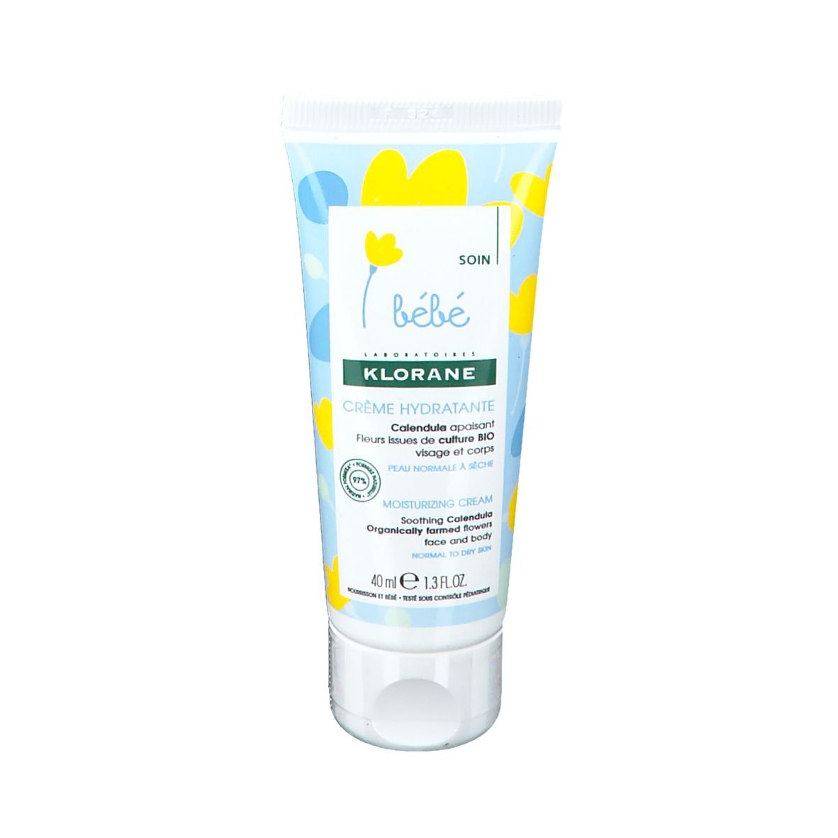 Creme-Tube mit floralem Design. Text: Klorane, Crème Hydratante, Bébé. Für Gesicht und Körper. 40 ml.